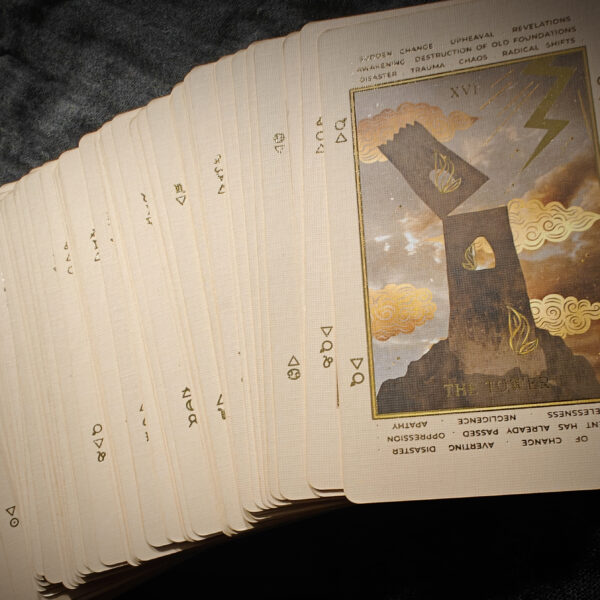 a stack of cards on a black surface