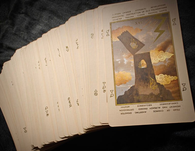 a stack of cards on a black surface
