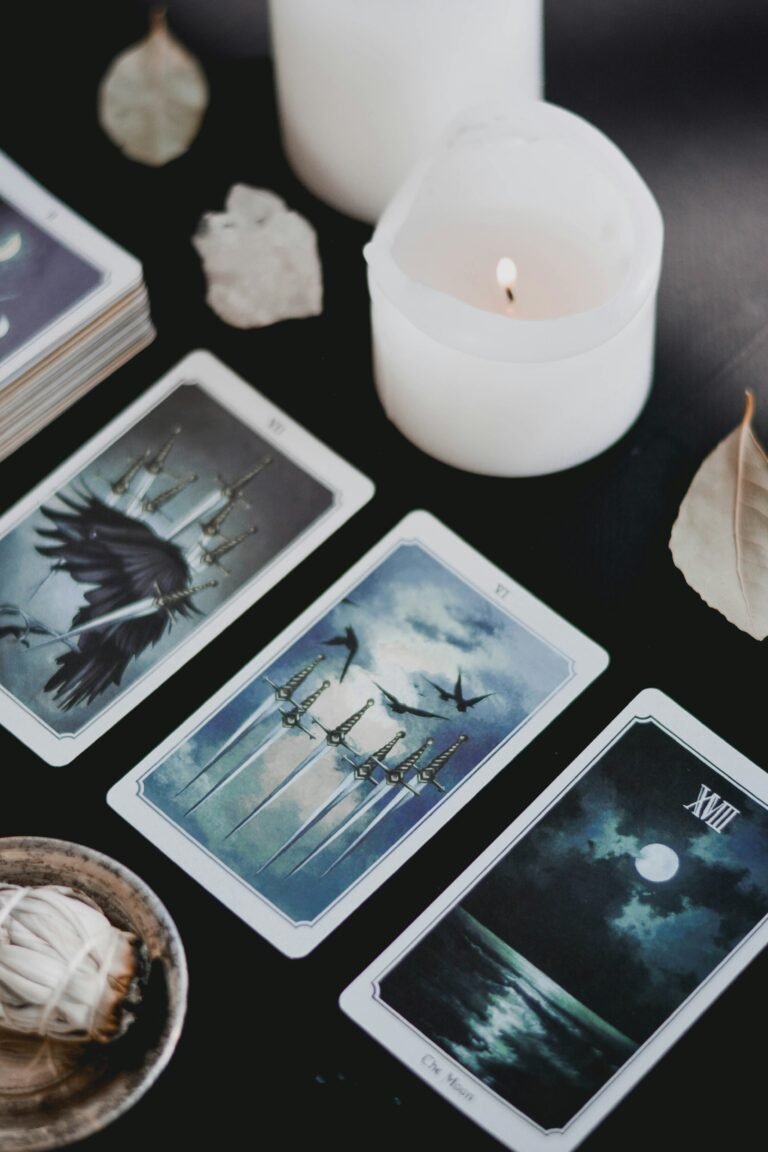 a group of tarot cards and a candle